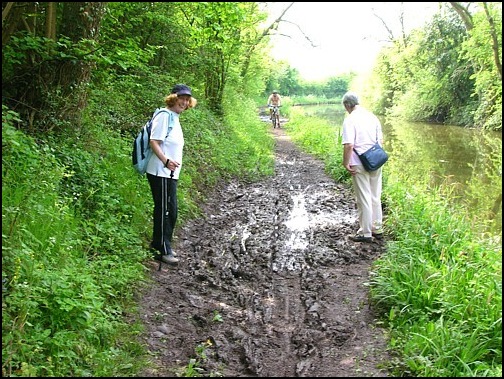But no improvements had taken place further along the tow path. <br />Annis smiles at the camera while Chris contemplates the best way to cross the quagmire.<br />
