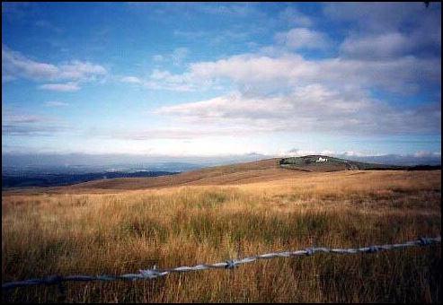 Open moorland. The white building to the right is the farm at Bowstonegate.