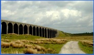 A slight glimmer of afternoon sunshine on the Ribblehead Viaduct .