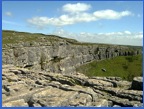 The view looking east over Malham Cove .