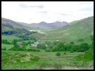 Looking over Capel Curig to the Snowdon Horseshoe .